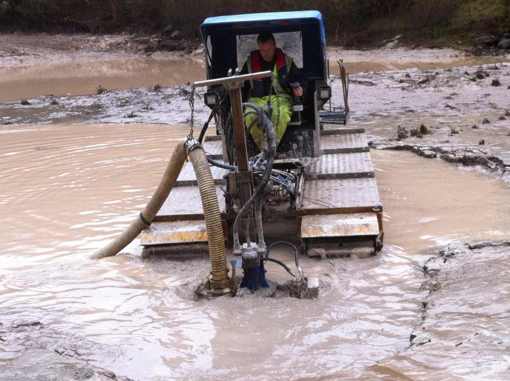 Truxor amphibious vehicle removing silt, dredging, silt pumping